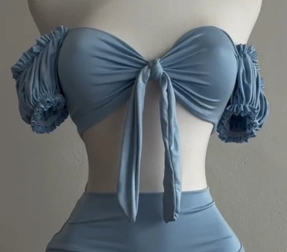 A sexy and fashionable two-piece short skirt with hollowed-out pleated puffed sleeves that wraps the hips Aviola