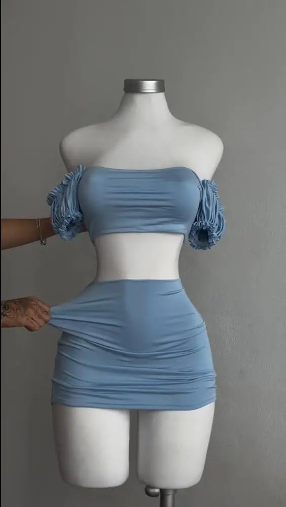 A sexy and fashionable two-piece short skirt with hollowed-out pleated puffed sleeves that wraps the hips Aviola